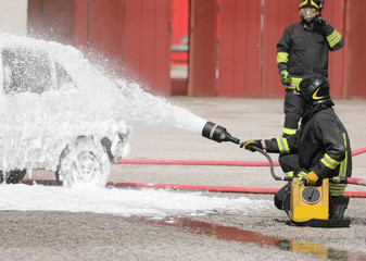 fireman uses a foaming agent to put out the fire