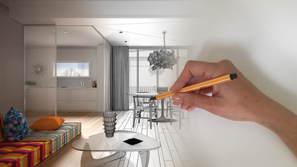 Architect interior designer concept: hand drawing a design interior project while the space becomes...
