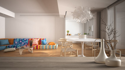 Wooden table top or shelf with minimalistic modern vases over blurred modern colored living room with kitchen and dining table, parquet floor, minimalist architecture interior design