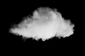White powder explosion isolated on black background. White dust particles splash.
