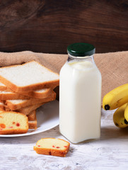 Healthy Food Milk, Bread, Cake And Banana On Table