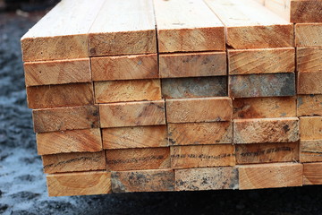 Boards on the sawmill. New boards produced at a wood processing enterprise.