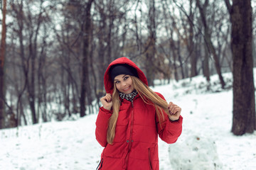 December walk with a young pretty blonde