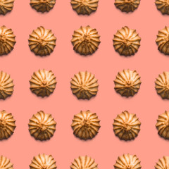 Sweet fresh crispy cookies on pink background. Seamless texture. Top view