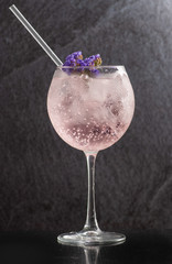drinks lemonade with different flavors: watermelon, grapefruit, blueberries, orange. different wine glasses on black background