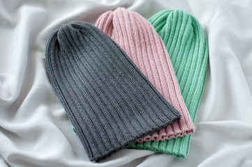 Three knitted hats for children