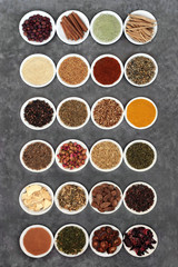 Herbs and spice for a healthy heart and cardiovascular system used in natural and chinese herbal medicine on grey grunge background. Flat lay.