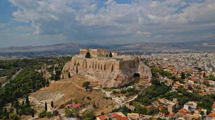 Obraz premium Aerial photo of unique Masterpiece of Ancient times the Parthenon on top of iconic Acropolis hill with beautiful clouds and blue sky, Athens, Attica, Greece