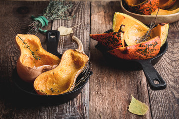 Baked pumpkins with thyme in cast iron skillet