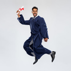 education, graduation and people concept - happy smiling indian male graduate student in bachelor...