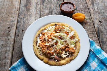 Mexican food: sopes of Picadillo beef with cheese and beans