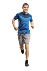 Young man jogging towards the camera