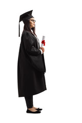 Female graduate student in a black gown holding a diploma