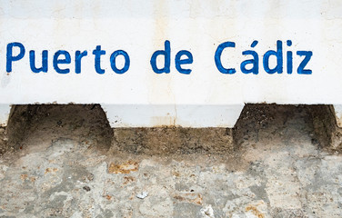 harbor of Cadiz (Puerto de Cadiz) sign at entrance of  harbor