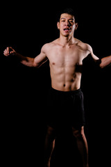 Fototapeta premium athletic muscular bodybuilder man with naked torso six pack abs. fitness workout concept