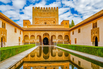Fototapeta premium Columns and tower of the Alhambra in a sunny day. It´s a Nasrid monument