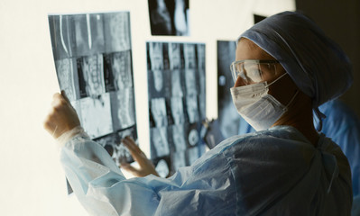 Two female women medical doctors looking at x-rays in a hospita