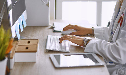 young woman doctor takes patient in office