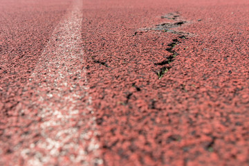 Sport playground for running with a deep crack