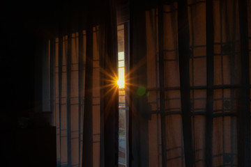 Sunlight pass through curtain gap in the morning