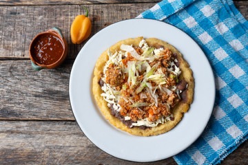 Mexican food: sopes of Picadillo beef with cheese and beans