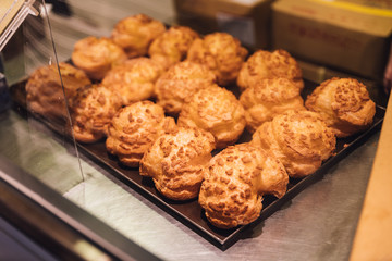 Freshly baked Vanilla Choux Cream Puffs for sell. Fresh Baked Bakery.