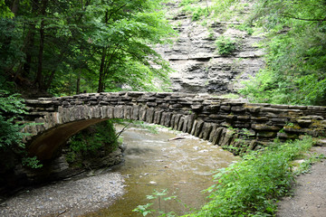 Fototapeta na wymiar Stone Wood Bridge Connection Connect Join Separate Creek Stream River Together Hike Trail