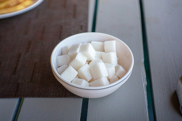 Sugar cubes on a plate in a plate