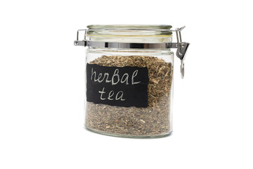 Herbal tea in a glass jar, flip-top closure, isolated on white background