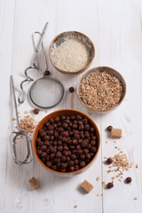 Flakes, sugar, seeds semi-cook for porridge close up in white key