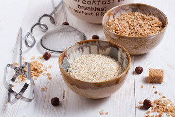 Flakes, sugar, seeds semi-cook for porridge close up in white key