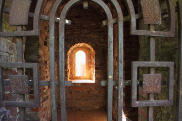 Smolensk, Russia, iron door and window loophole close up in old city fortress wall in Park...
