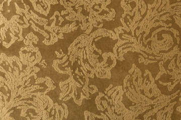 Gold surface of nap fabric, velours. Texture for background and design.