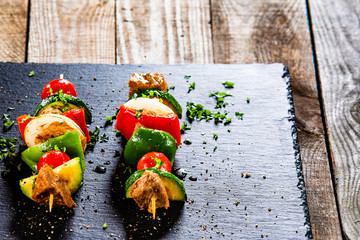 Grilled shashliks with chicken on blask stone plate © Jacek Chabraszewski