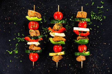 Grilled shashliks with chicken on blask stone plate © Jacek Chabraszewski