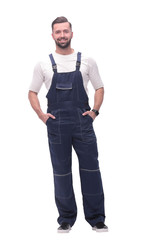 in full growth. smiling man in overalls.