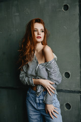 young woman fashion studio portrait, brunette in stylish clothes