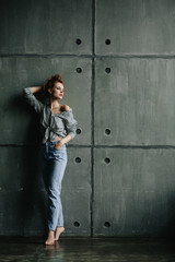 young woman fashion studio portrait, brunette in stylish clothes