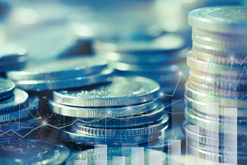 Financial investment concept, Double exposure of stack of coins and city for finance investor, Forex trading market candlestick chart, Cryptocurrency Digital economy. investing growing.
