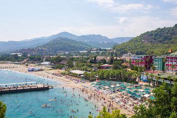 Kanakly, Alanya, Turkey - April 24, 2019: Sunny Alanya beach in Turkey with sea view. View from the fortress on the mountain. Mediterranean Sea