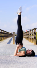 sport and lifestyle concept - woman doing sports outdoors