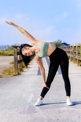 sport and lifestyle concept - woman doing sports outdoors