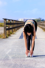 sport and lifestyle concept - woman doing sports outdoors