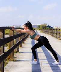 sport and lifestyle concept - woman doing sports outdoors