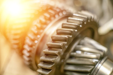 The gears from the car's gearbox close up. Photo with illumination, light