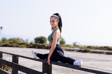 sport and lifestyle concept - woman doing sports outdoors