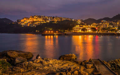 Fototapeta na wymiar Romantic evening Panorama of Stanley Village on Hongkong Island. Chek Chue, Hong Kong, China