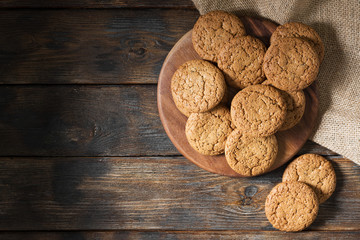 Oatmeal cookies on a wooden round Board. Rustic style. Top view