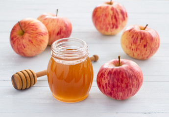 Apples and honey on a wooden background for jewish new year rosh hashanah	
