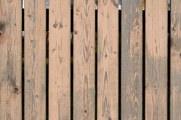 Old wood fence with cracked and peeling off paint